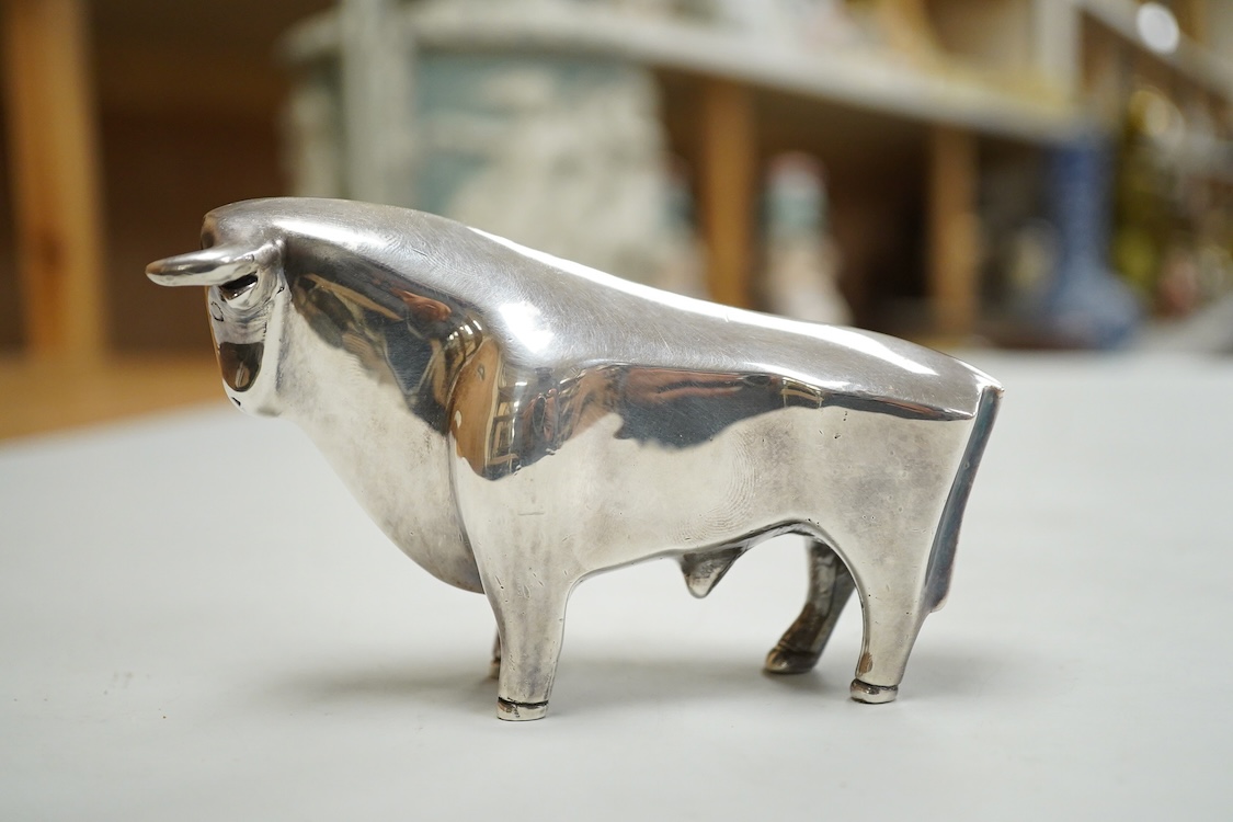 A stylised white metal (stamped 925) miniature model of a bull, length 11.5cm, height 7cm, 30oz.